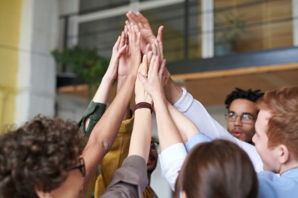 photo-of-people-touching-each-other-s-hands-3184428